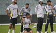India's Varun Chakravarthy, Axar Patel, and Ravi Bishnoi, along with others, attend a prac...