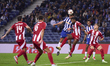 Nehuen Perez of FC Porto competes for the ball with Rodinei Marcelo de Almeida of Olympiac...