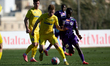 Danylo Malov of NK Domzale vies for the ball with Ben Bobzien of Austria Klagenfurt during...