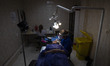 A female Iranian medical staff member performs an eyebrow transplant for a woman at the Je...