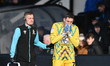 Goalkeeper Marko Marosi of Cambridge United holds his head in his hands after getting inju...