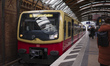 People wait at the platform for an S-Bahn train at a station in Mitte, Berlin, on January...