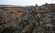 Soldiers of the 110th Territorial Defence Brigade are in the trench during a live fire exe...
