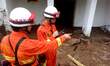 Rescuers search for signs of life at the landslide site in Taining County, southeast China...