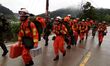 Rescuers rush to the landslide site in Taining County, southeast China's Fujian Province,...