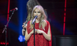 Suki Waterhouse performs onstage during the American Heart Association's Go Red for Women...