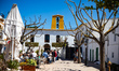 People walk in the streets of Santa Gertrudis de Fruitera on the island of Ibiza, Spain, o...