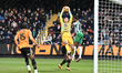 Goalkeeper Jack Stevens of Cambridge United catches the ball during the Sky Bet League 1 m...