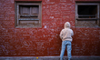 A boy writes on the wall of Saraswati Temple, where the Hindu Goddess is worshipped annual...