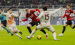 Santiago Gimenez and Mats Hummels play during the Coppa Italia match between AC Milan and...
