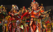 Performers dance down the street during the Chingay Parade, themed 'JOY' at the F1 Pit Bui...