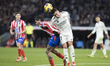 Lucas Vazquez of Real Madrid and Rodrigo De Paul of Atletico de Madrid fight for the ball...