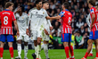 Jude Bellingham of Real Madrid CF argues with Jorge Resurreccion Merodio (Koke) of Atletic...
