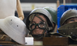 Detail of military objects and army helmets at a stand at the 13th Edition of the Recyclin...