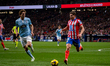 Julian Alvarez of Atletico de Madrid (R) is in action with the ball, defended by Marcos Al...