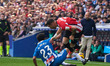 Omar El Hilal of RCD Espanyol makes a sliding tackle to dispossess Alex Berenguer of Athle...