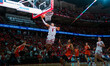 Wisconsin Badgers guard John Tonje #9 makes an easy layup on a fast break against the Illi...