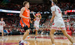 Wisconsin Badgers guard John Tonje #9 hits a step-back three-pointer against the Illinois...