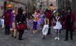 Costumed and masked people parade through the streets of Bassano Romano, Italy, on Februar...
