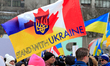 Participants hold a combined Canadian-Ukrainian flag during a rally to support Ukraine on...