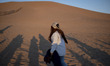 A foreign tourist walks in the Varzaneh desert, located south of the historic city of Isfa...