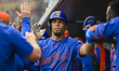 Rafael Ortega of the New York Mets, #0, celebrates the runs during a Grapefruit League spr...