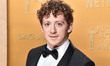 Ethan Slater wearing a Giorgio Armani tuxedo arrives at the 31st Annual Screen Actors Guil...