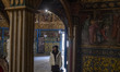A woman looks on while visiting the Vank Cathedral-Armenian Apostolic historical Church in...