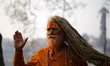 A Sadhu, or Hindu holy man, is pictured on the premises of Pashupatinath Temple on the eve...