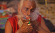 A Sadhu, or Hindu holy man, smokes marijuana on the premises of Pashupatinath Temple in Ka...