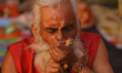A Sadhu, or Hindu holy man, smokes marijuana on the premises of Pashupatinath Temple in Ka...