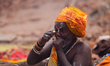 A Sadhu, or Hindu holy man, smokes marijuana on the premises of Pashupatinath Temple in Ka...