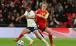 Nikita Parris of Brighton and Hove Albion, representing England Women, holds off Irene Par...