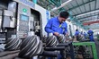 A worker works in a workshop at a gear manufacturing enterprise in Qingzhou Economic Devel...