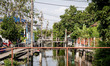 A canal runs through Bangkok. Daily life occurs on the outskirts of East Bangkok, Thailand...