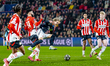PSV Eindhoven midfielder Ismael Saibari and Arsenal midfielder Martin Odegaard play during...