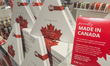 CALGARY, CANADA - MARCH 4, 2025:'Made in Canada' stickers placed next to price tags of Ca...