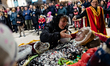 Figurants participate in a procession during the death of the puppet Mba Biose on Shrove T...