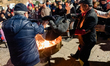 Figurants throw the puppet Mba Biose into the fire after his death on Shrove Tuesday in Ru...