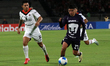 Piero Quispe #27 of Pumas de la UNAM and Alejandro Bran #14 of Liga Deportiva Alajuelense...