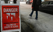 OTTAWA, CANADA - MARCH 6:A warning board reading 'Danger - Falling Ice and Snow' in downt...
