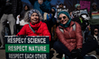 Amy Selmanoff (left) and Julie McArthur, both from Baltimore participate with thousands of...