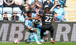 #10, Ephron Mason-Clark of Coventry City and #22, Junior Tchamadeu of Stoke City battle fo...