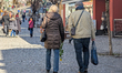 Locals and tourists spend a sunny day in the pedestrian zone in Murnau, Garmisch-Partenkir...