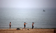 Palestinian youths are on the beach of Gaza City, Palestine, on March 15, 2025, during the...