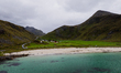 An aerial view shows Skagsanden Beach, a white sand beach with turquoise water in Lofoten,...
