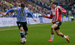 Pol Valentin of Sheffield Wednesday and Sydie Peck of Sheffield United are present during...