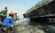  Men of the fire service at the scene of a tanker explosion on Wednesday near Karu Bridge,...