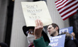 Over 100 U.S. postal workers and supporters gather on the steps of the James A. Farley pos...