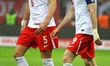 Jan Bednarek and Robert Lewandowski participate in a match of the FIFA World Cup 2026 Qual...